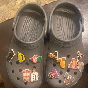 Used grey crocs with office charms